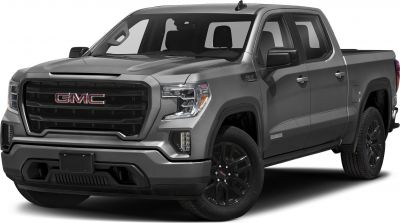 Front three-quarter view of a pickup with rugged grille and headlamp design