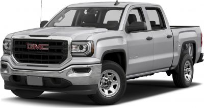 Front grille and headlights of a silver double cab pickup.