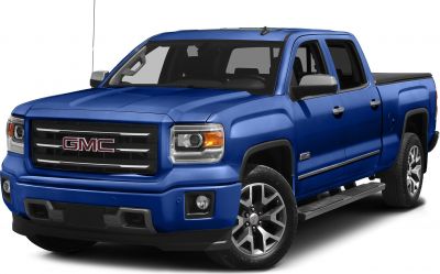 Front view of a blue pickup featuring rugged grille and alloy wheels