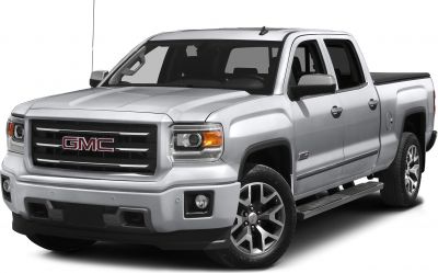 Silver pickup truck with bold grille and alloy wheels