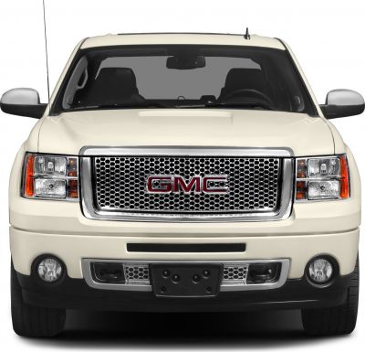 Front honeycomb grille with dual square headlights.