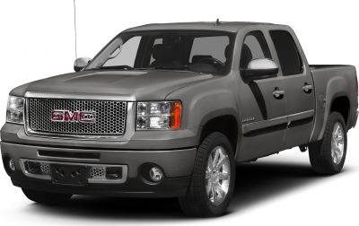Front-side view of pickup with polished grille and crew cab configuration