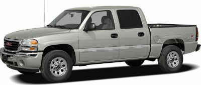 Silver crew cab pickup truck side view with 4x4 and alloy wheels.