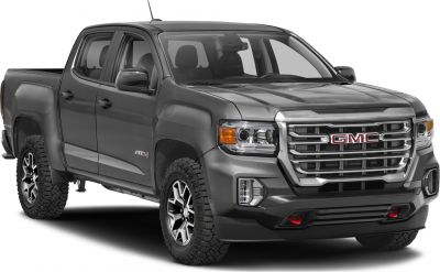 Front angled view of extended cab pickup with bold grille and rugged tires