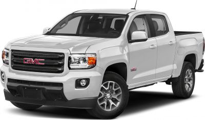 Front-side view of white mid-size pickup truck with crew cab