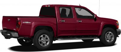 Side and rear view of extended crew cab pickup truck with off-road badges