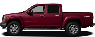 Side profile of a crew cab off-road pickup with chrome wheels