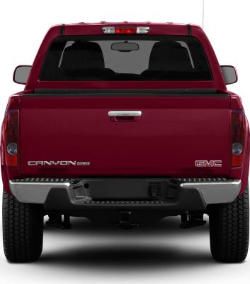 Rear view of crew cab pickup with tailgate and chrome bumper