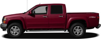 Side profile of a midsize pickup truck with crew cab and off-road wheels