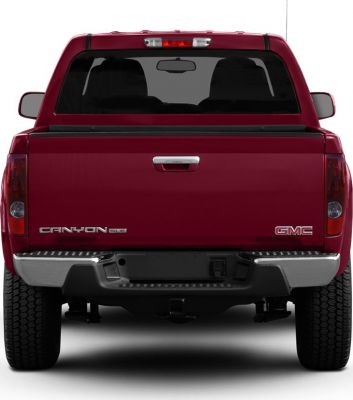 Rear view of pickup truck showing tailgate and bumper.