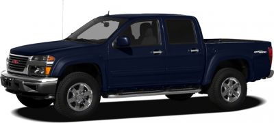 Dark blue crew cab pickup with off-road tires and chrome accents.