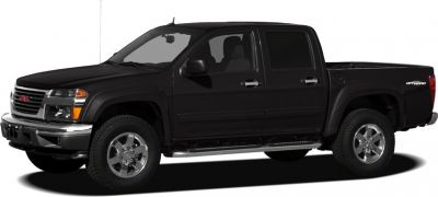 Black crew cab pickup with off-road tires and chrome wheels side view