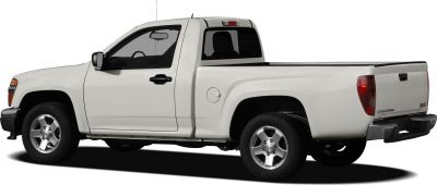 White pickup truck with regular cab, extended bed, and visible wheels and taillights.