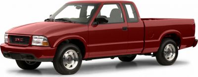 Red extended cab pickup with alloy wheels and distinctive front fascia