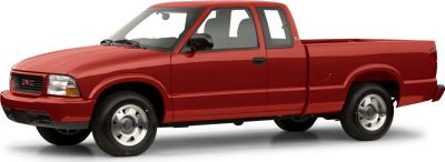 Red extended cab pickup truck with smooth body design and alloy wheels