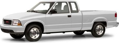 White extended cab pickup truck with steel wheels and spacious bed