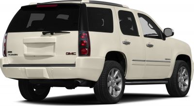 Rear view of full-size SUV with tinted windows and alloy wheels