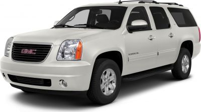 Front 3-quarter view of a large SUV with bold grille and clear headlights