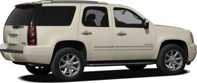 Side profile of large SUV with Denali trim and roof rails