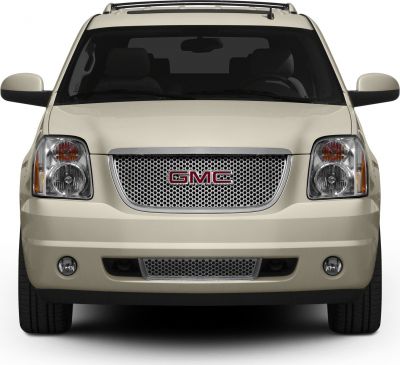Front view with mesh grille, dual headlights, fog lights, and beige body