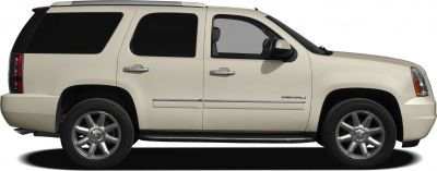 Side profile of full-size SUV with alloy wheels and dark tinted windows