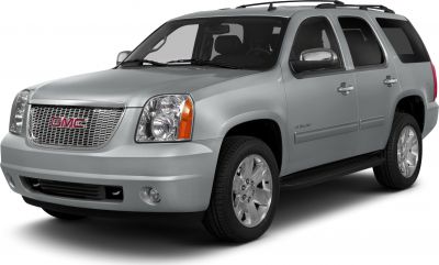 Silver SUV with prominent grille, headlights, and alloy wheels