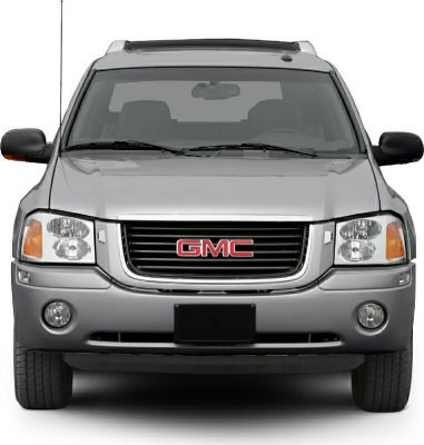 Front grille, headlights, and fog lights of an SUV.