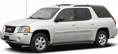 Side view of white SUV with distinctive rear compartment and extended body