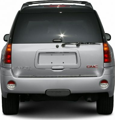 Rear view of SUV with tailgate, rear wiper, taillights, and GMC badge