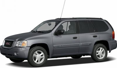 Side profile view of gray SUV with front end and wheels visible