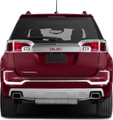 Rear view with tailgate, dual exhausts, taillights, and chrome trim