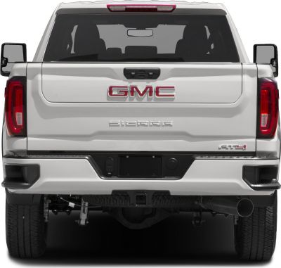 Rear view of pickup truck with GMC, Sierra badges, and AT4 trim