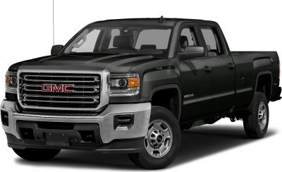 Heavy-duty pickup truck with double cab and standard bed, rugged front grille.
