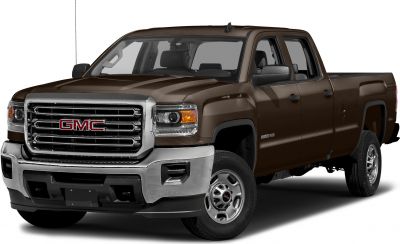 Front angled view with chrome grille and rugged body of a double cab pickup.