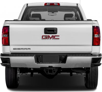 Rear view of pickup tailgate with GMC emblem and large bumper