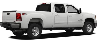 Extended cab long box pickup truck with 4x4 and chrome wheels side view