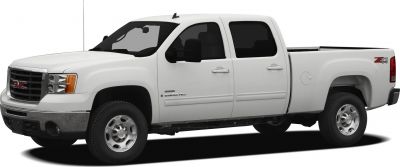 White extended cab pickup truck with standard cargo box and off-road tires