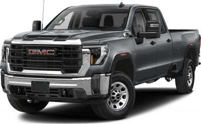 Front-side view of a rugged heavy-duty pickup truck with a large grille and double cab