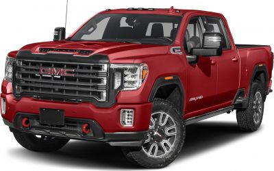 Bold front grille and rugged tires on red full-size pickup truck
