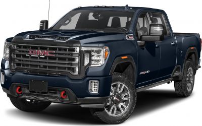 Front and side view of heavy-duty pickup with bold grill and extended mirrors