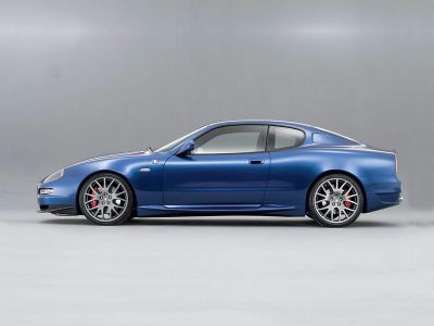 Sleek coupe side profile with alloy wheels