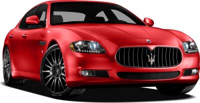 Front angled view of red luxury sedan with aggressive grille and sporty wheels.