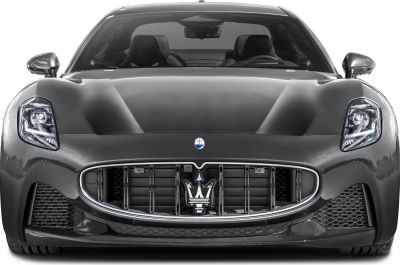 Front grille and sleek LED headlights with aerodynamic hood and twin seats visible inside.