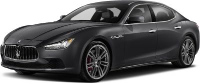 Front side view of luxury sedan with distinctive grille and sporty wheels