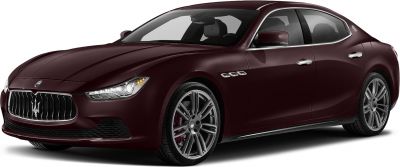 Luxury sedan front side view with prominent grille and alloy wheels