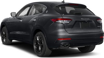 Rear side profile with black alloy wheels and quad exhaust tips