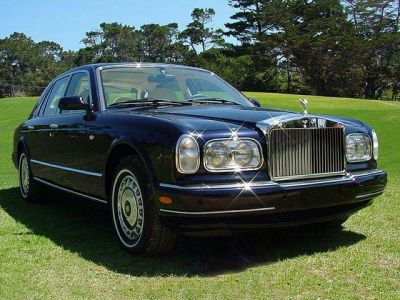 Luxury sedan front with distinctive grille and dual rectangular headlights