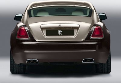 Luxury coupe rear view with dual exhaust and distinctive taillights