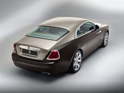 Luxury coupe rear view with distinctive taillights and dual exhaust