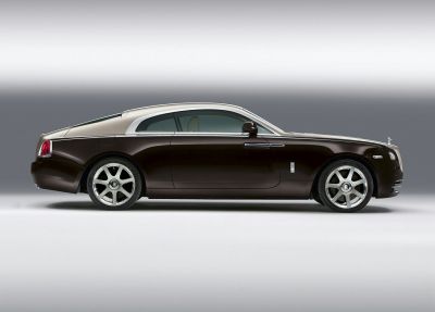 Sleek two-tone luxury coupe side profile with premium wheels